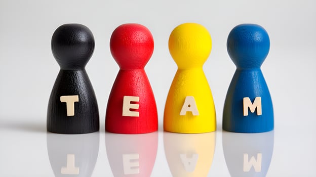 Colorful pawns representing a team standing together photo