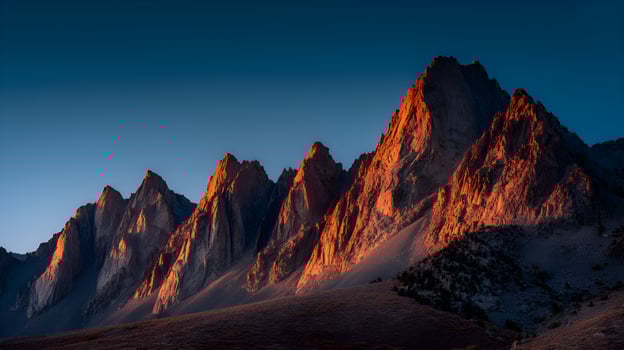 Mountain peaks glowing at sunset photo