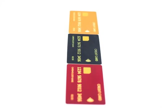 Stack of colorful generic credit cards on a white background symbolizing financial transactions photo