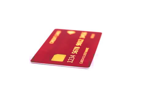 Close-up of a red credit card with gold details isolated on white background providing financial payment access photo