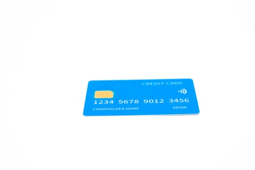 Isolated Blue Credit Card with Chip and Contactless Symbol on White Background photo