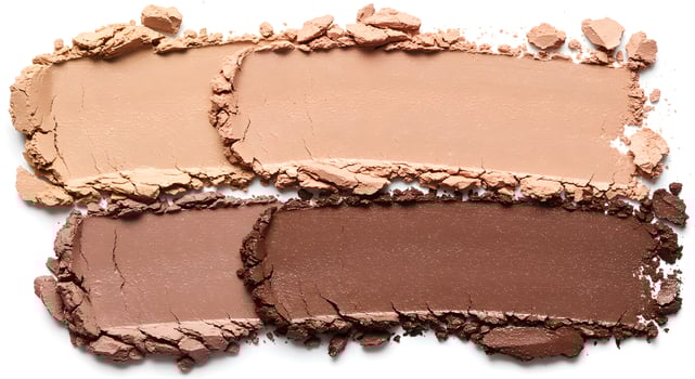 Macro overhead view of beige, taupe, brown eyeshadow strokes highlighting powdery texture, shimmer, and subtle lighting effects. photo