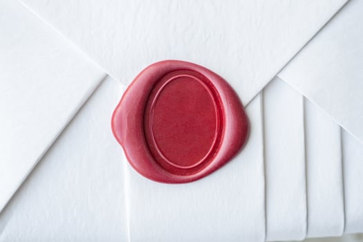 Wax seal stamp on white paper wrap packaging parcel box photo