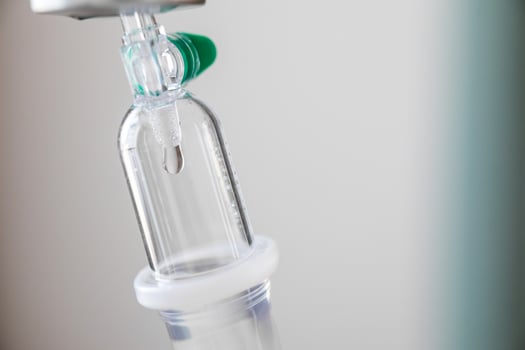 A medical drip is attached to a drip photo