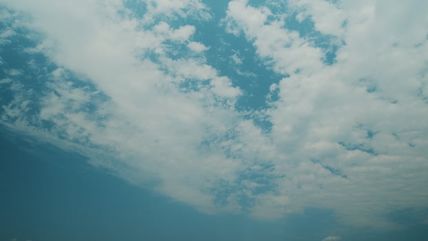 Time lapse. Serene Sky Gradients and Soft Fluffy Clouds Floating Overhead During Daytime Hours photo