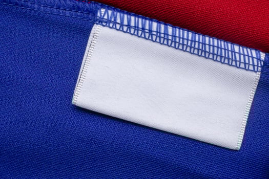 A close up of a blue and red shirt with a white pocket photo