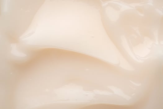 A close up of a cream with a white background photo