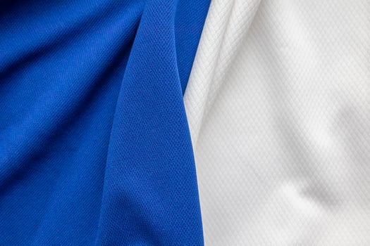 Blue and white sports clothing fabric football shirt jersey texture background photo
