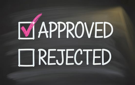 Checklist with approved selected and rejected unselected on a chalkboard photo