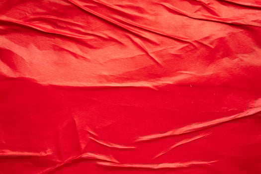A red cloth with folds and wrinkles photo