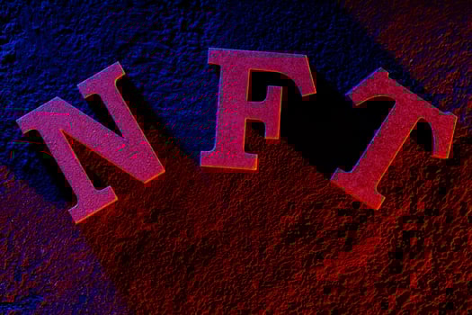 NFT Letters Glowing with Neon Light on Dark Background photo