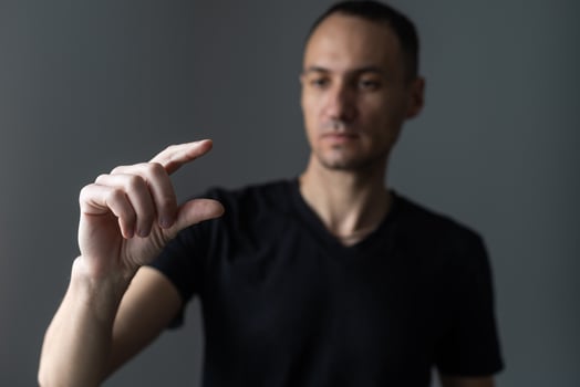 man points his finger at you. photo