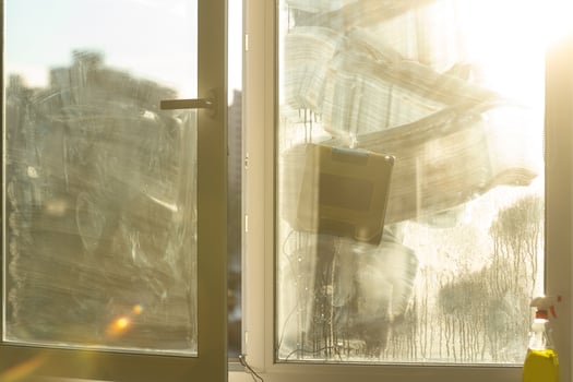 Window with very dirty and dusty glass in daylight. cleaning robot photo