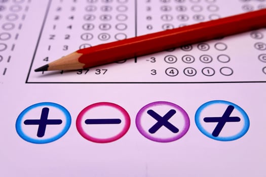 Red pencil and answer choices on a test paper photo