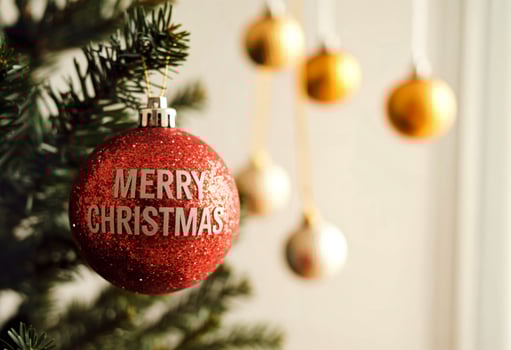 Merry christmas ornaments on christmas tree photo