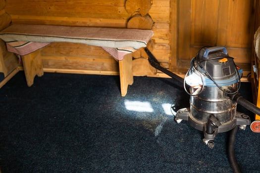Vacuum cleaner on the floor. Cleaning home photo