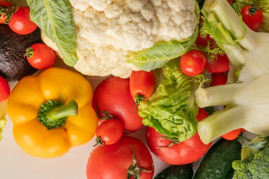 Cornucopia of vibrant vegetables, evoking Mediterranean harvest festivals and National Vegetarian Week, colorful symphony of sustainable living bounty photo