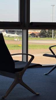 Empty airport chair silhouettes bask in serene sunlight, evoking aviation wanderlust and long forgotten Peregrinatio festival vibes photo