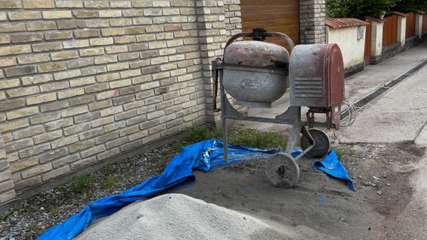 Vintage cement mixer whispering tales of urban alchemy, neighborhood renewal, artisanal concrete craftsmanship, and Labor Day celebrations photo