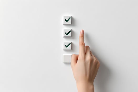A hand pressing a button with a check mark on it photo
