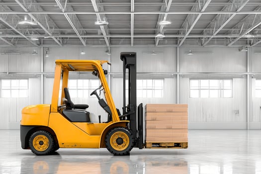 A forklift truck in a warehouse with boxes on the ground photo