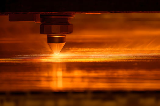 A laser cutting machine is being used to cut metal photo