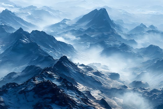 A view of the mountains with fog and snow photo