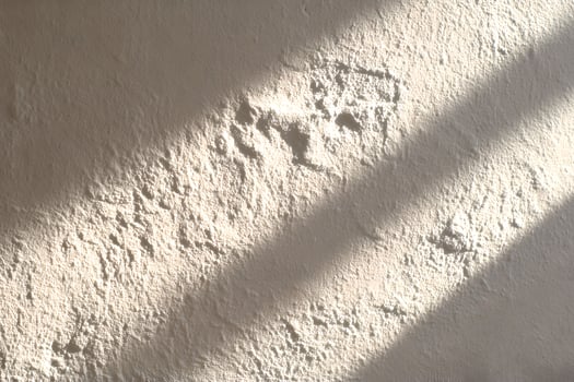 A white wall with a shadow on it photo