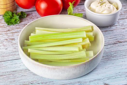 Celery in a bowl with tomatoes and herbs photo