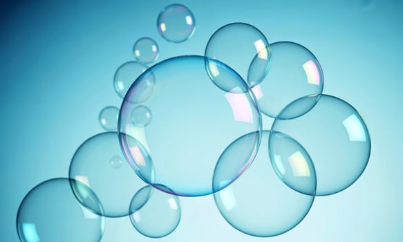 Clear translucent bubbles floating in a soft blue gradient background photo