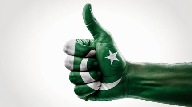 Pakistan flag painted on hand showing thumbs up photo