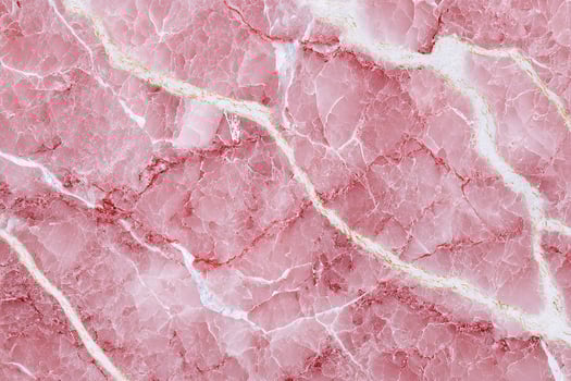 Natural pink marble texture with bold white veins creating a unique and eye-catching stone pattern photo