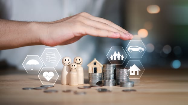 Financial family planning concept with coins, wooden figures, and insurance icons under protective hand, symbolizing budgeting, future savings, financial security, and protection of health and assets. photo