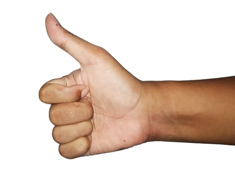 Stock Photo of Man's Hand Raising Thumbs Up, Hand gesture as on white background