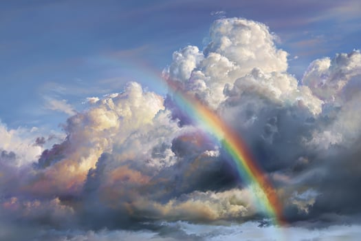 Serene realistic cloudy sky with a colorful rainbow stretching across the horizon after light rain photo