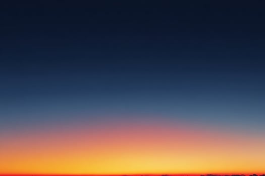 Beautiful realistic twilight sky featuring a gradient of orange to blue lighting the tranquil evening sky photo