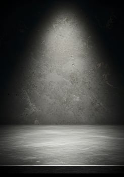 Dramatic Spotlight on Grungy Concrete Wall and Floor Background photo