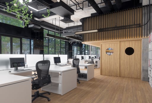 Modern office space with empty desks and computers. Contemporary workspace for business and productivity. photo
