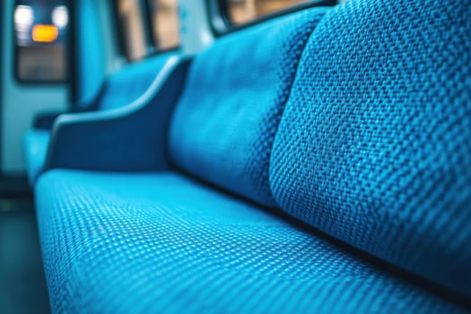 A blue couch on a train photo