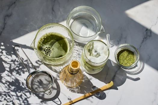 Matcha Tea Preparation. Flat lay of matcha tea ingredients and tools photo
