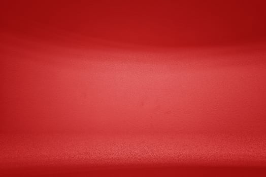 Empty Room with Light Beam and Shadow on Red Wall Background photo