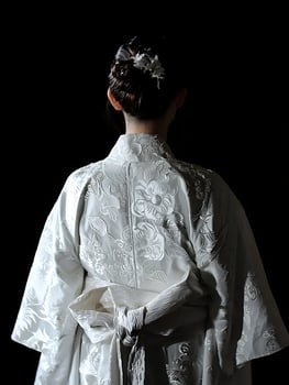 Elegant Woman in White Kimono with Floral Embroidery. photo