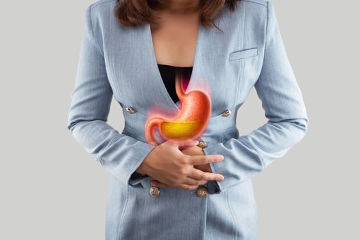 Woman with stomach pain from acid reflux. photo