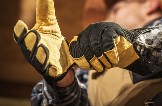 Skilled Worker Demonstrating Tool Handling Techniques in a Workshop Setting photo