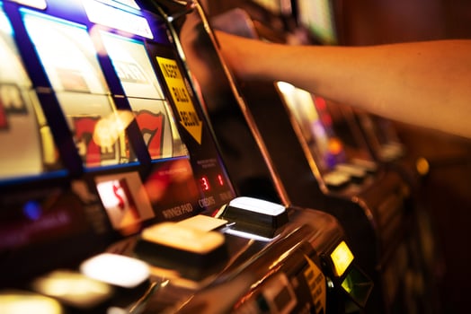 Player Engages With Slot Machine at Casino During Evening Entertainment photo