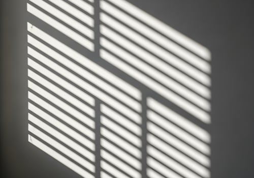 Geometric sunlight shadows on white wall creating high-resolution abstract background image with sharp edges, no people or objects in the frame photo