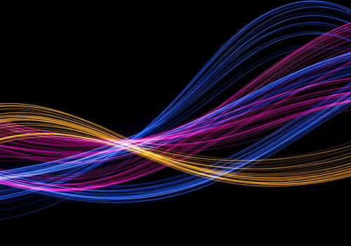 Fiber optic light trails in dark environment forming abstract wave shapes, high-resolution crisp and noise-free background image without humans photo