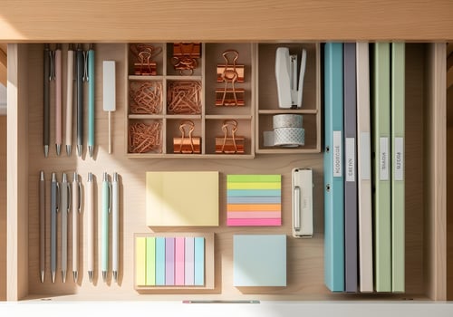 Flatlay of a meticulously organized office drawer with essential stationery, captured in clean minimalist composition with sharp detail and natural light photo