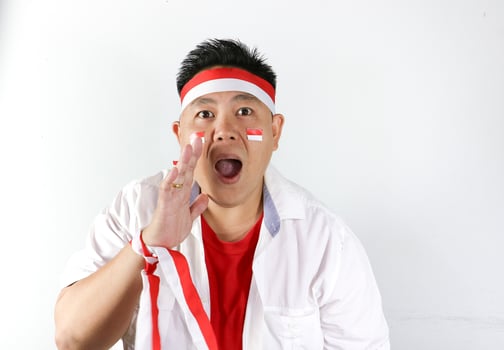 A man with a red and white headband and a red and white tie photo