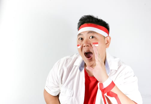 Asian man with indonesian flag on his head photo